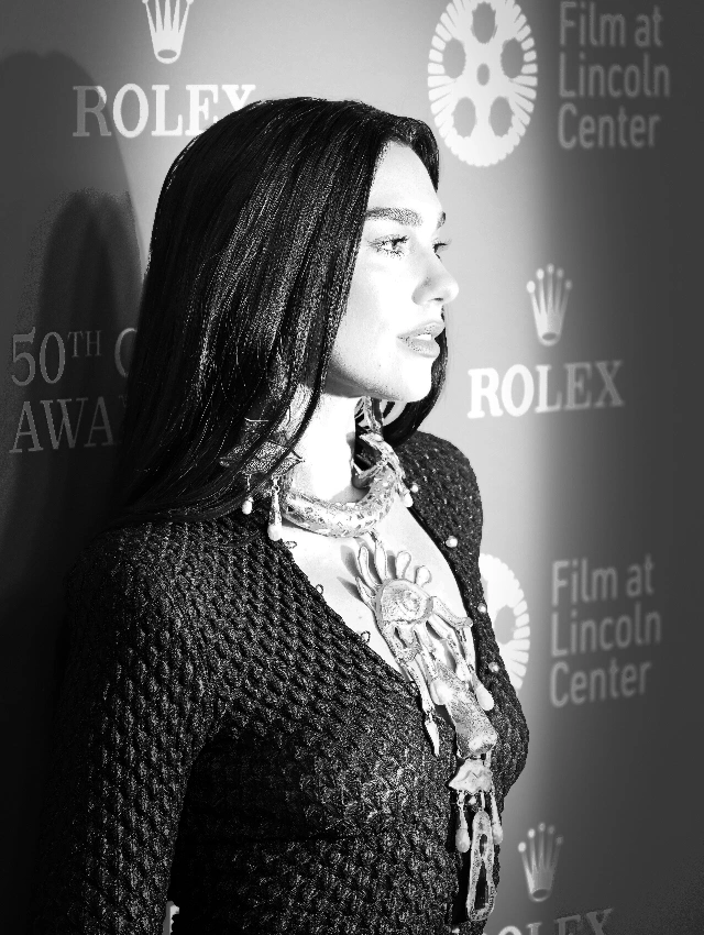 Portrait of Dua Lipa taken by photographer Philip Romano during an official studio photoshoot, showing a close-up fashion portrait